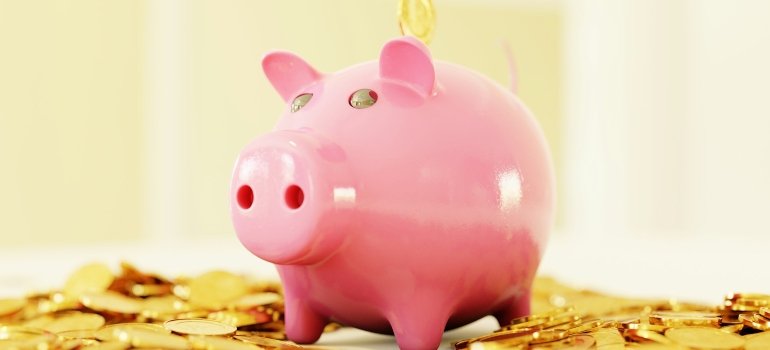 a piggy bank with coins ready for moving to San Antonio 