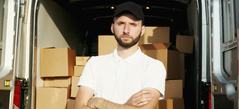 A mover from the movers Garden Ridge TX locals recommend stands cross armed