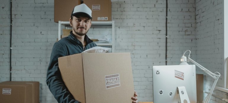 a professional mover carrying a box