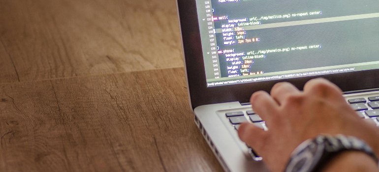 a person coding on a laptop