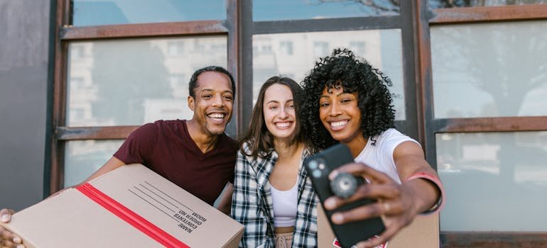 Two women taking selfie with one of the movers Helotes TX