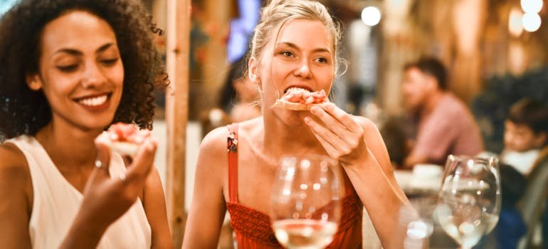 Two women enjoying culinary delights in towns around San Antonio