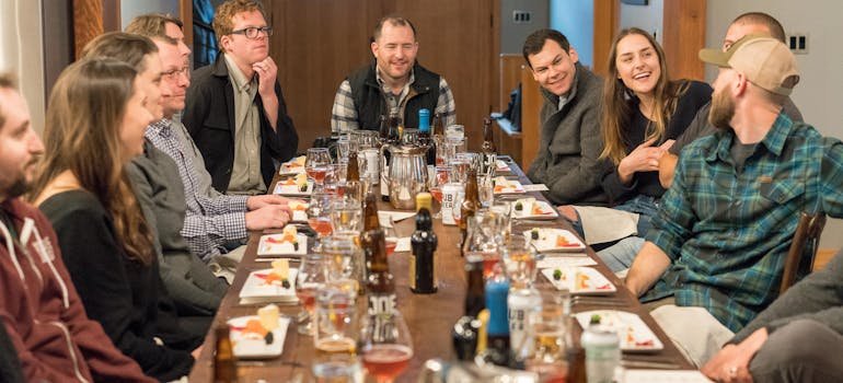 A group of people sitting at the dining table