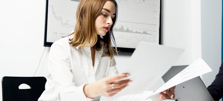 A person comparing two papers