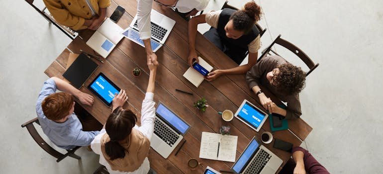 People in the office talking about the benefits of moving an office to San Antonio