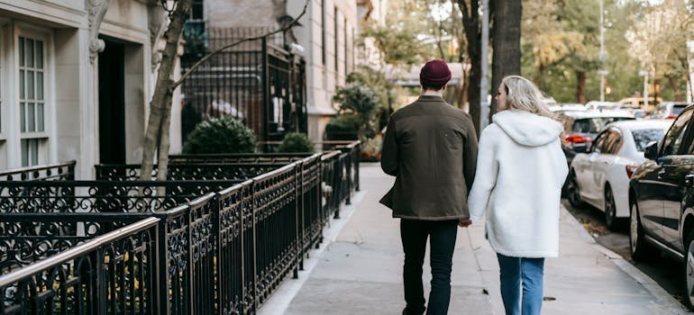 Two people walking on the street