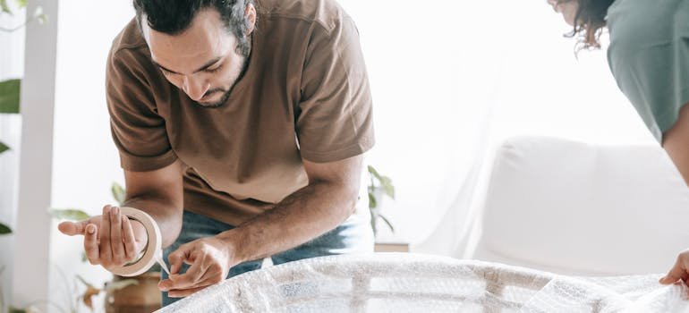 A man holding a sealing tape