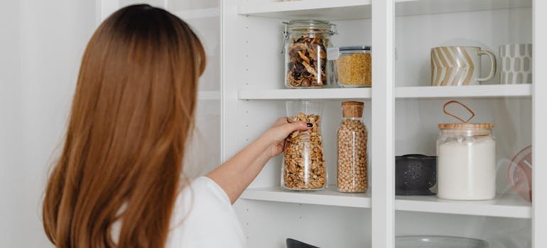 A woman organizing a kitchen