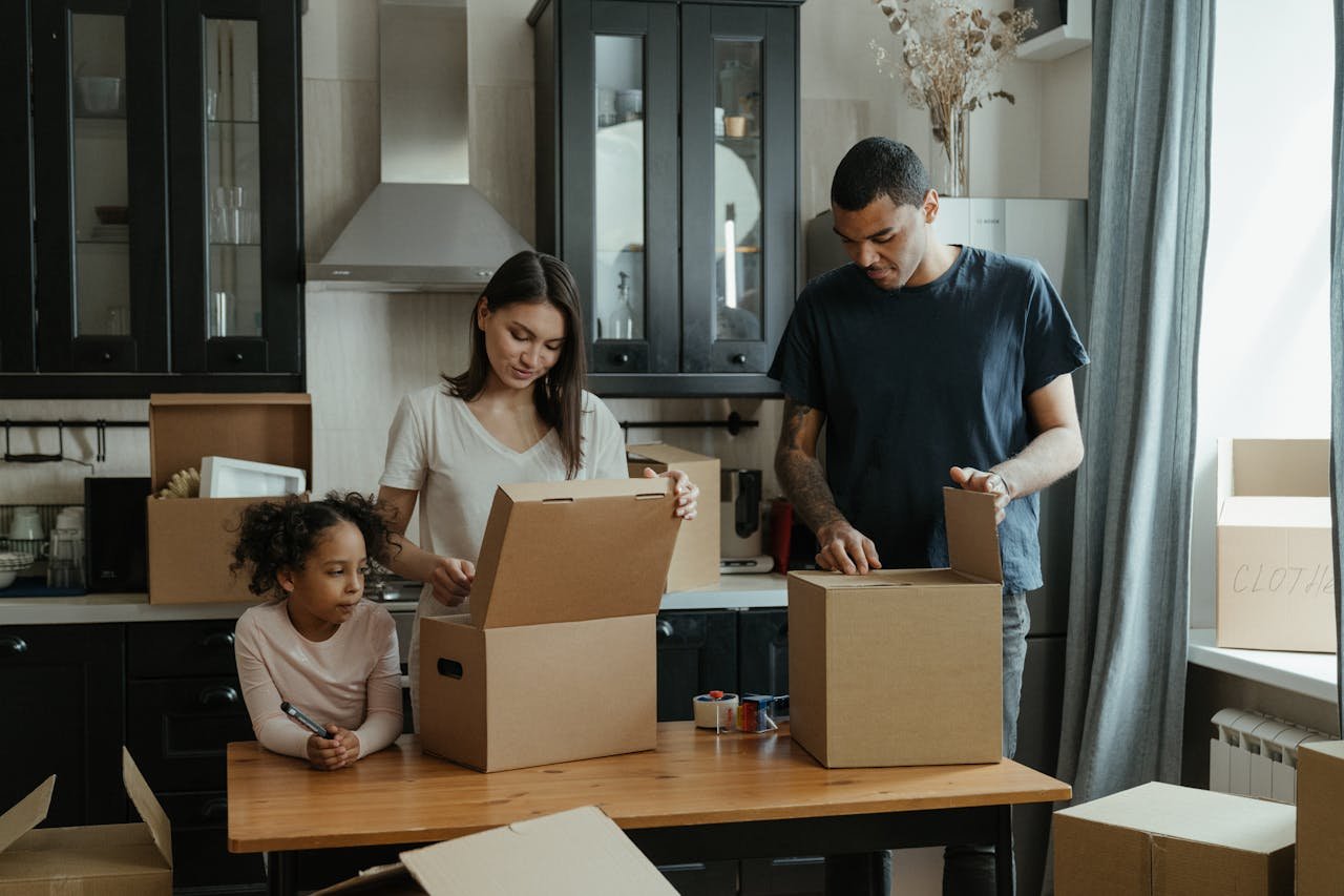 A family using unpacking strategies to settle into new home