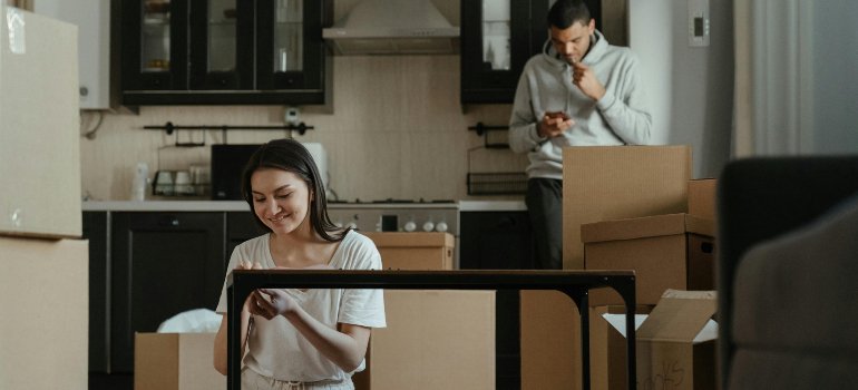 a couple packing for relocation