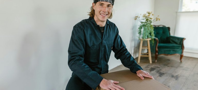 Professional mover preparing to handle furniture, showing the importance of protecting high-end furniture during a move in San Antonio.