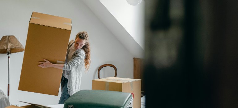 Lifting big boxes alone proves DIY moving isn’t always the smart choice.