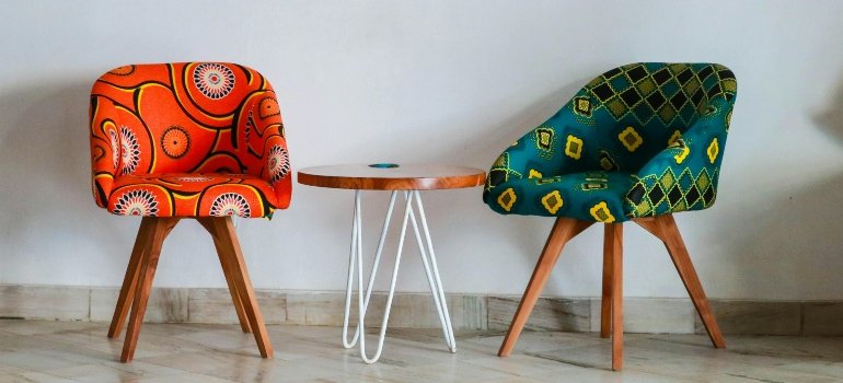 Green and red chair next to a coffee table