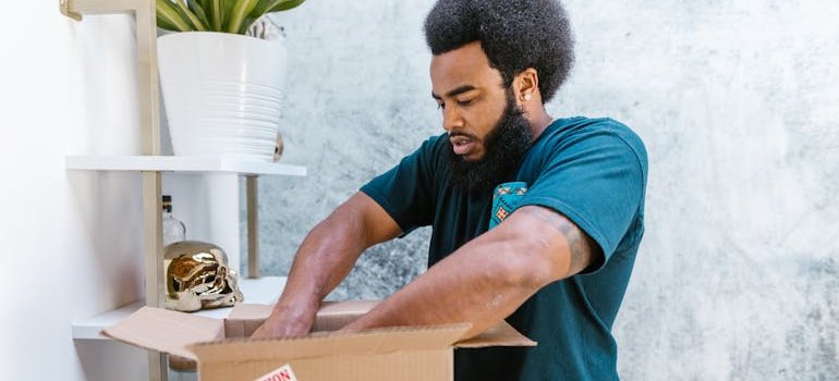 a mover looking through a box