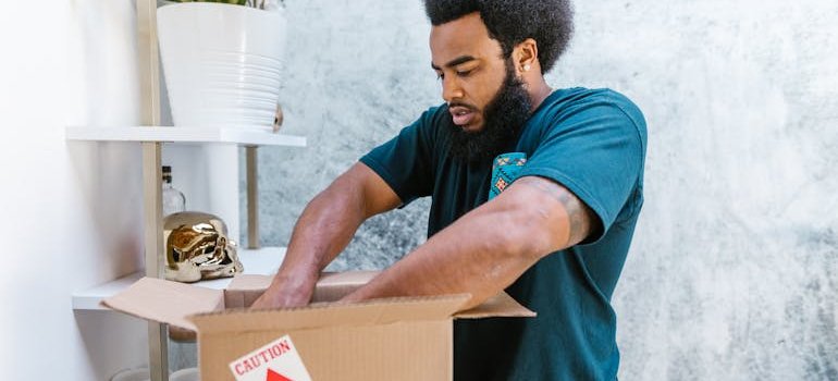 a mover packing the fragile items