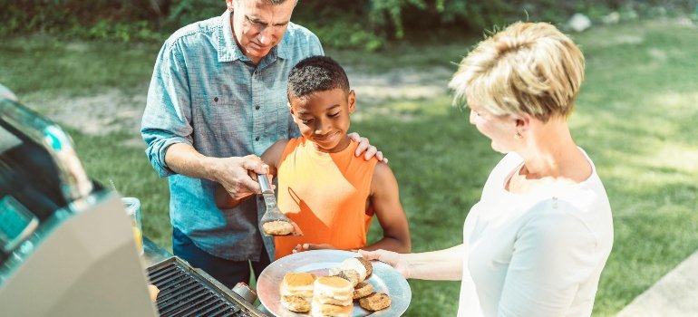 A Woman With Blond Hair Holding a Plate of Food