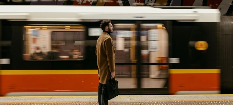a boy waiting for the train