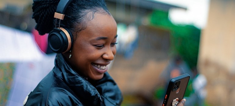 Person smiling while contacting movers Universal City Texas offers 