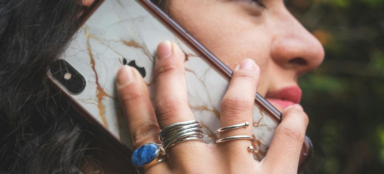 Person on a phone call getting information about movers Bulverde Texas has 