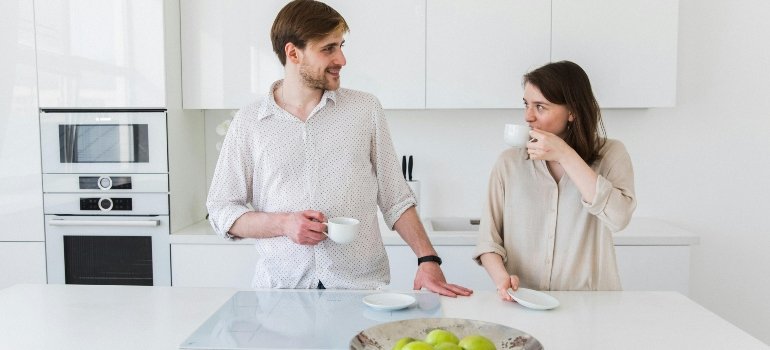 Couple Drinking in Kitchen