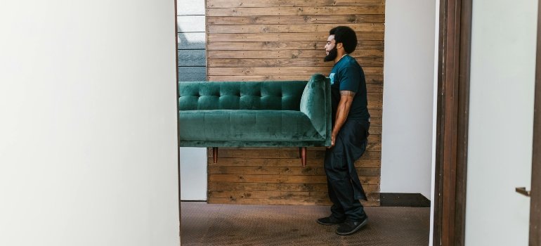 Lytle moving company carrying furniture.