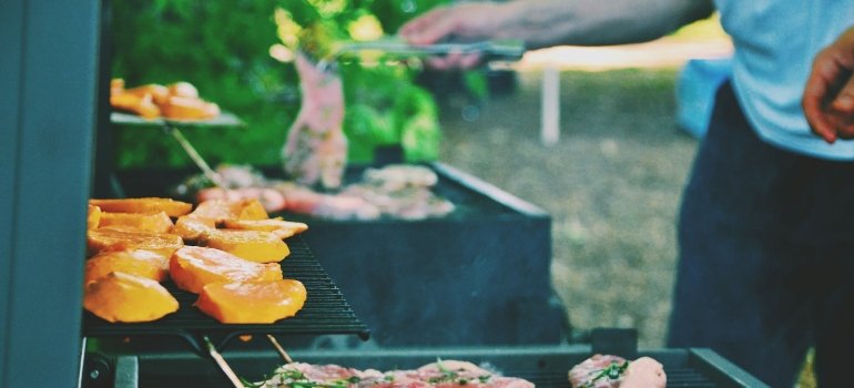 Picture of a person that is enjoying the backyard of his suburban home 