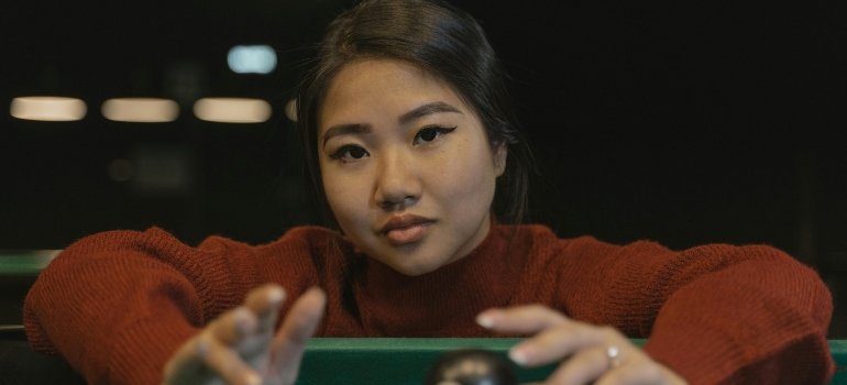 Close-Up Shot of a Woman in a Maroon Sweater