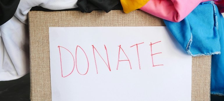 Box with clothes for donation during a move from Uvalde to Martinez