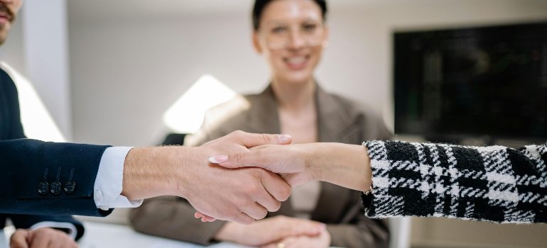 People Having a Deal by Doing Hand Shake