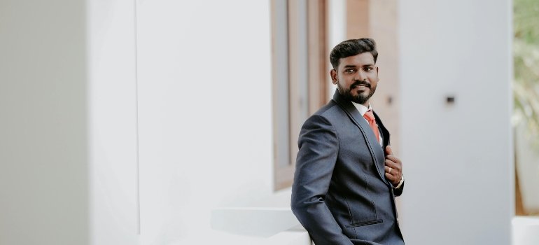 a man in black looking behind