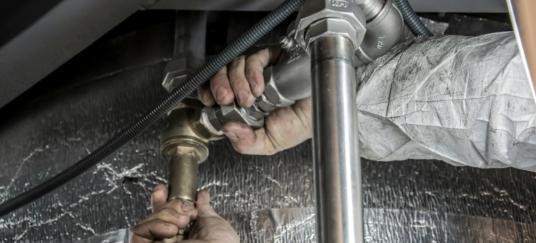 Plumber Installs Pipe Fittings